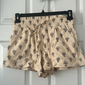 Size Small. Beige shorts with blue design, with tie. Never worn.